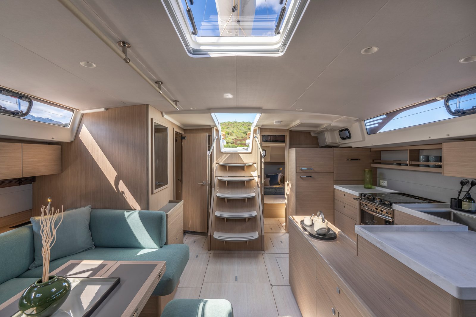 Yacht cabin interior with linen bedding and a porthole