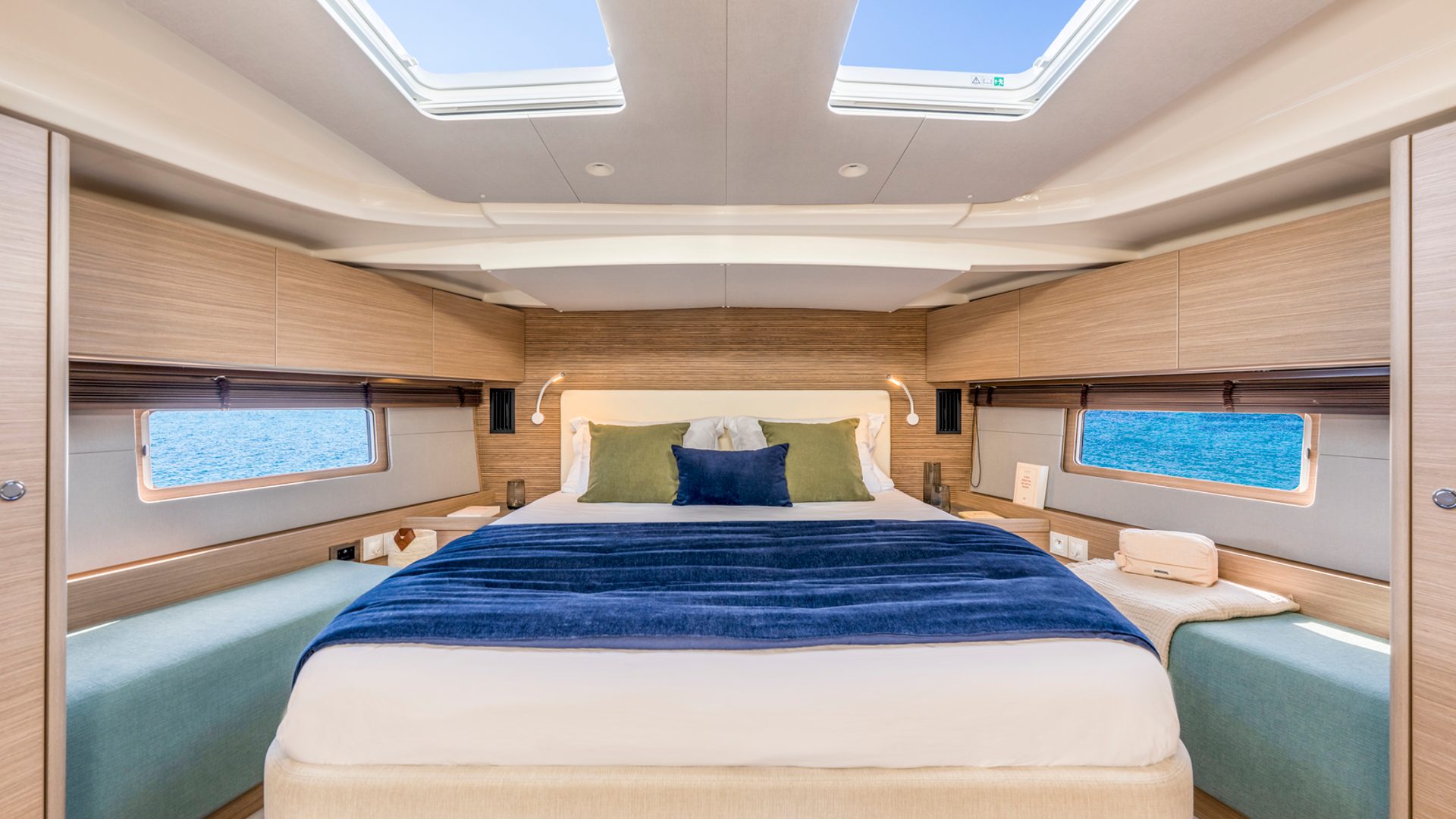 Owner cabin — queen berth, twin overhead skylights, sea-level ports.