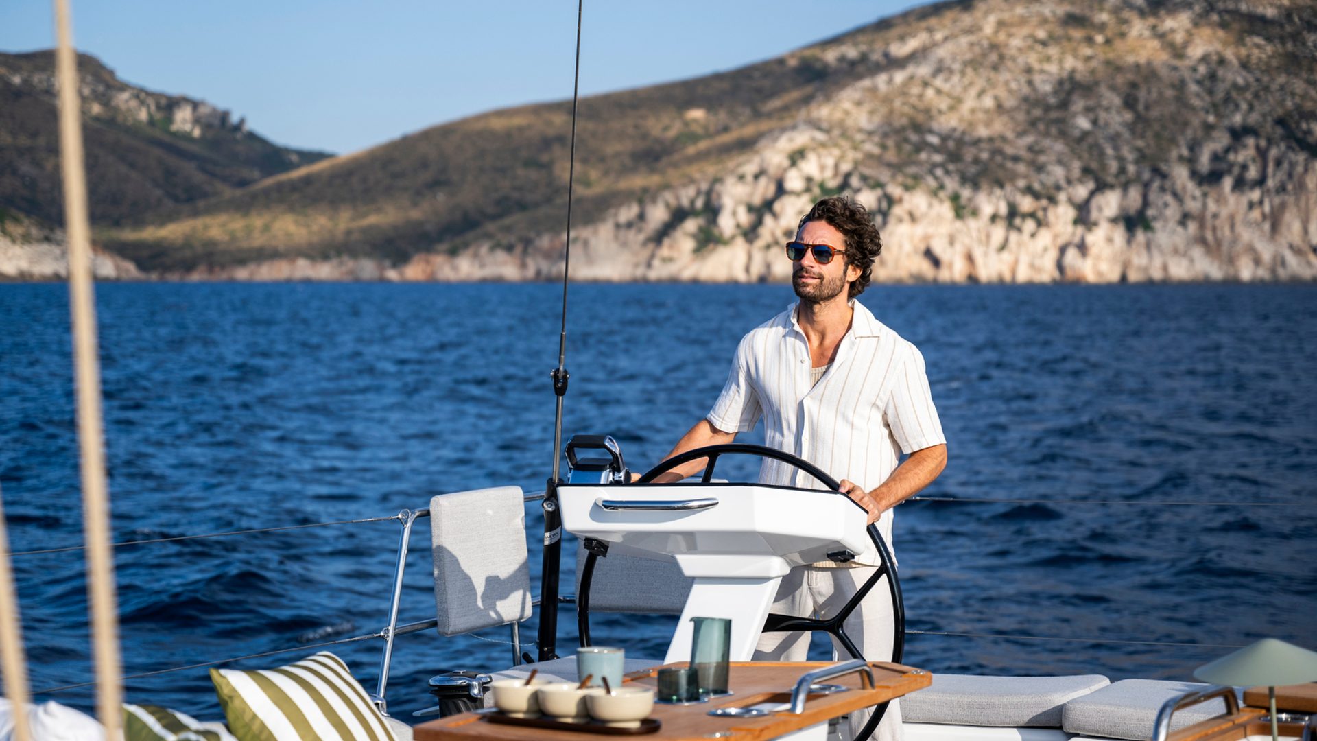 On watch — single helm, twin wheels, panoramic cockpit.